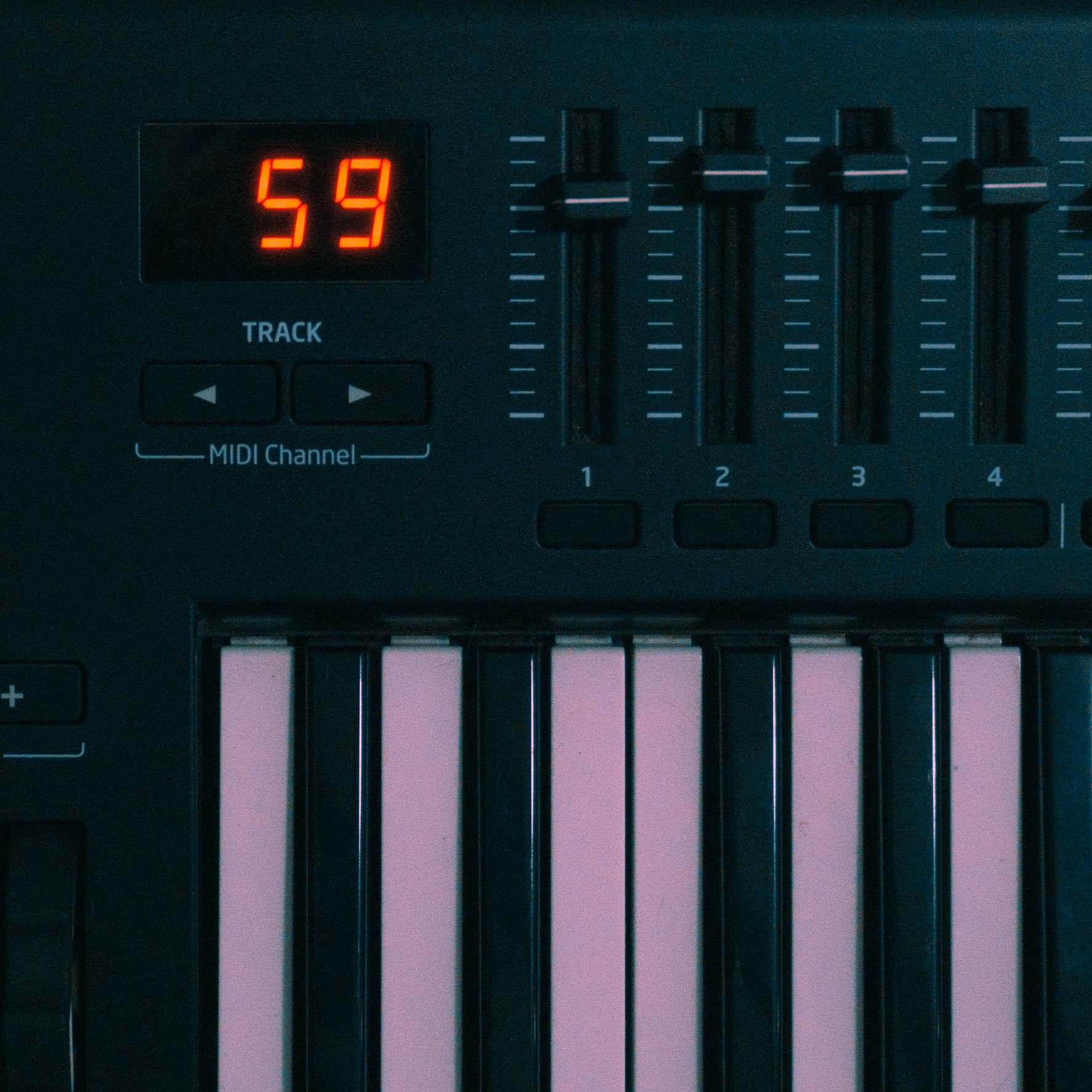 Keyboard with digital display and controls at a workspace